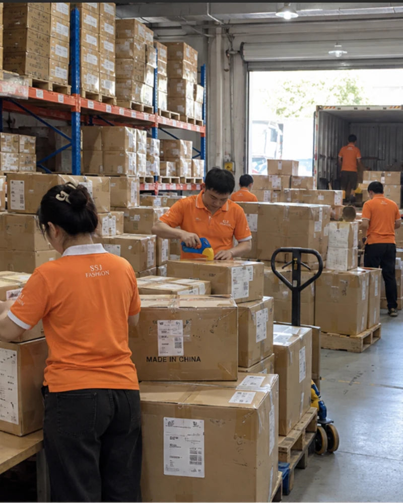 SSJ Fashion team packing cartons for international delivery