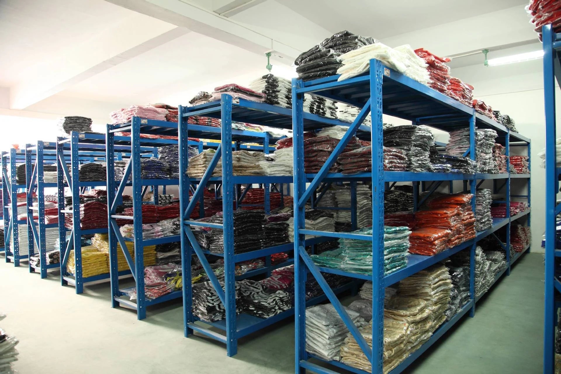 SSJ Fashion warehouse with packaged clothing ready for order preparation